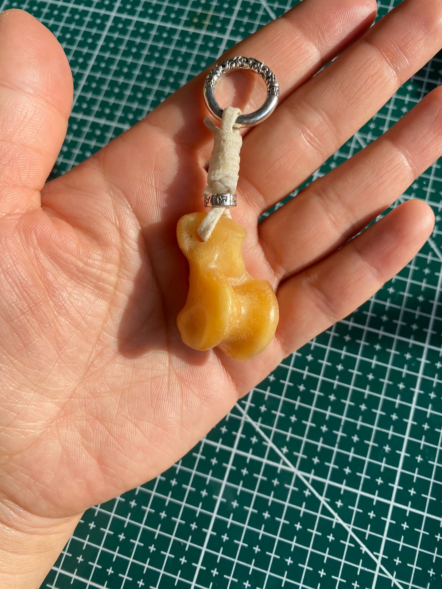 Handcrafted Bone-Shaped Pendant Keychain with White Cord and Silver-Toned Ring