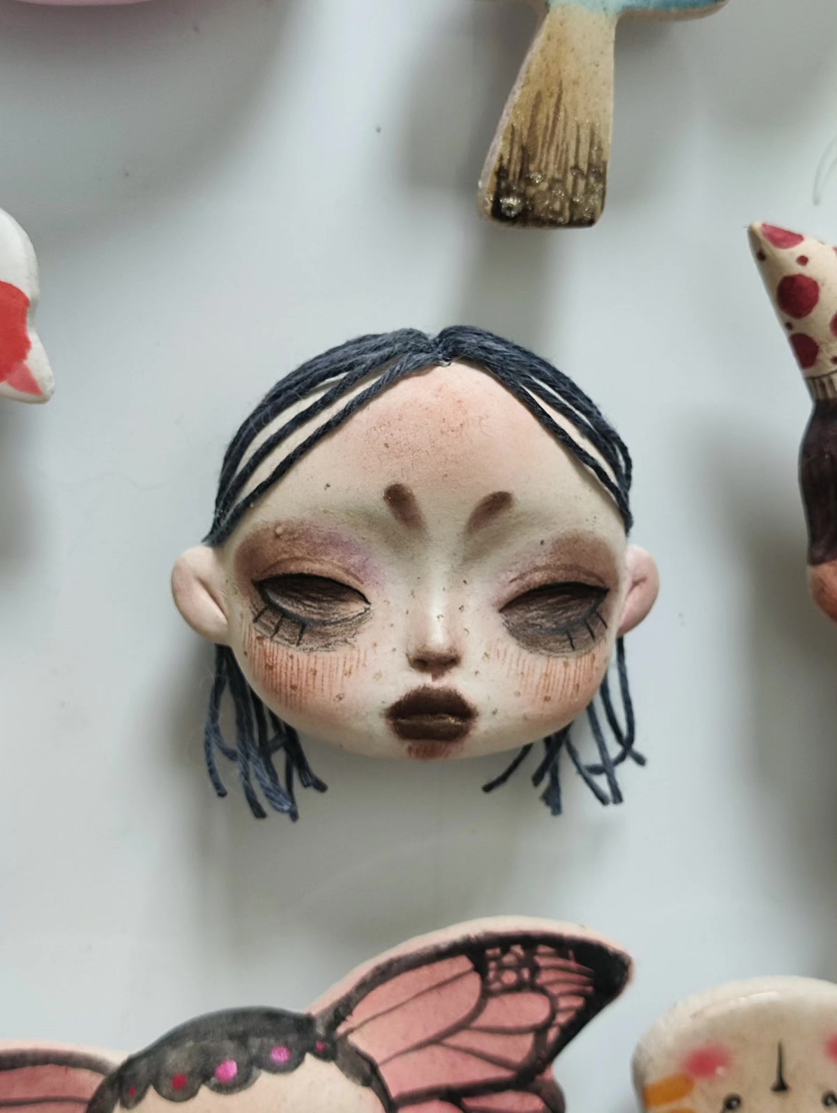 Clay Doll Head Brooch