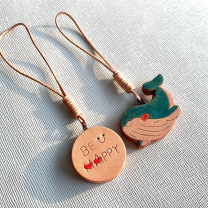 Handcrafted Leather Pendants: "BE HAPPY" Disc and Whale Charm