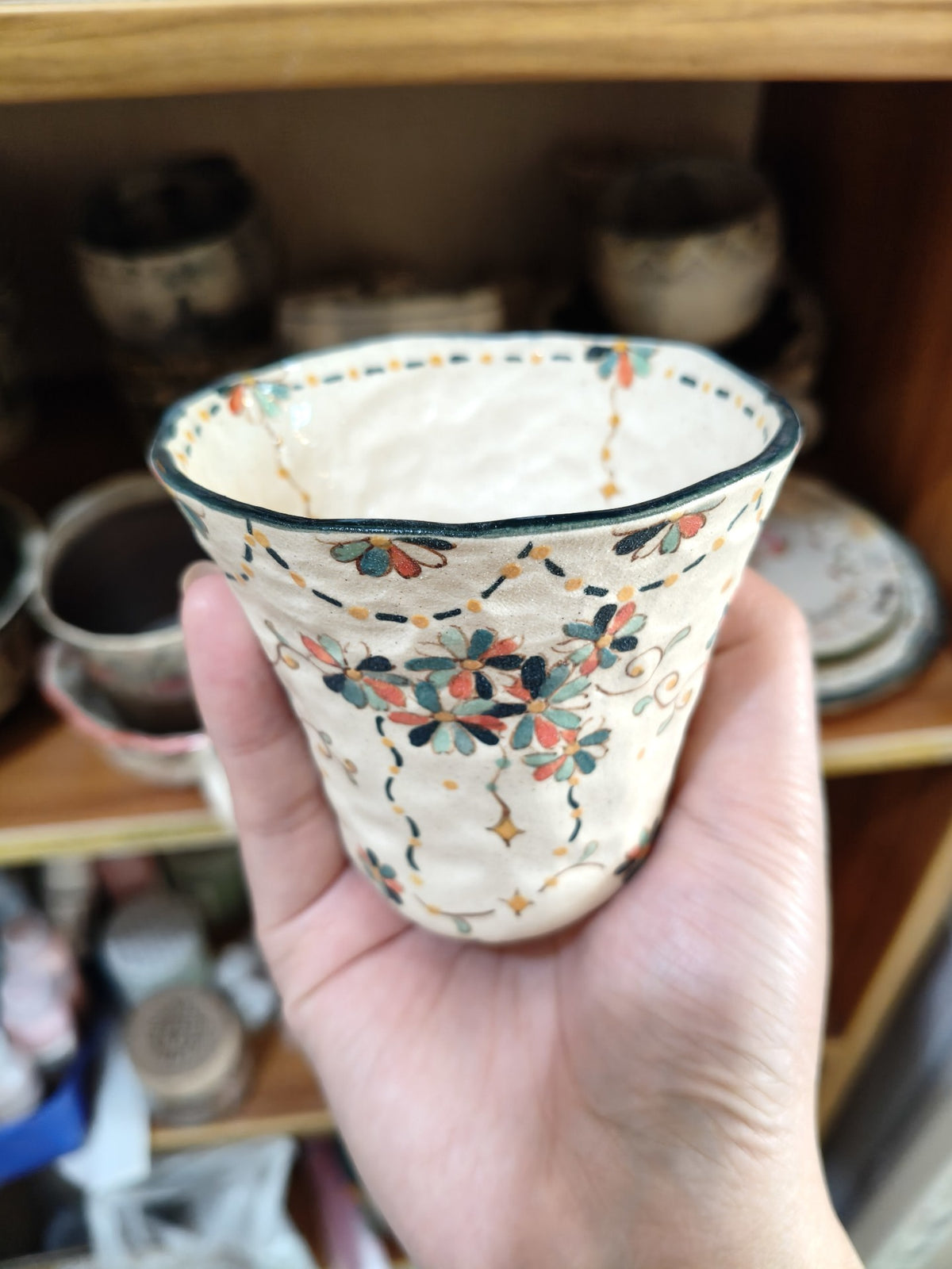 Handcrafted Ceramic Cup with Floral Motif