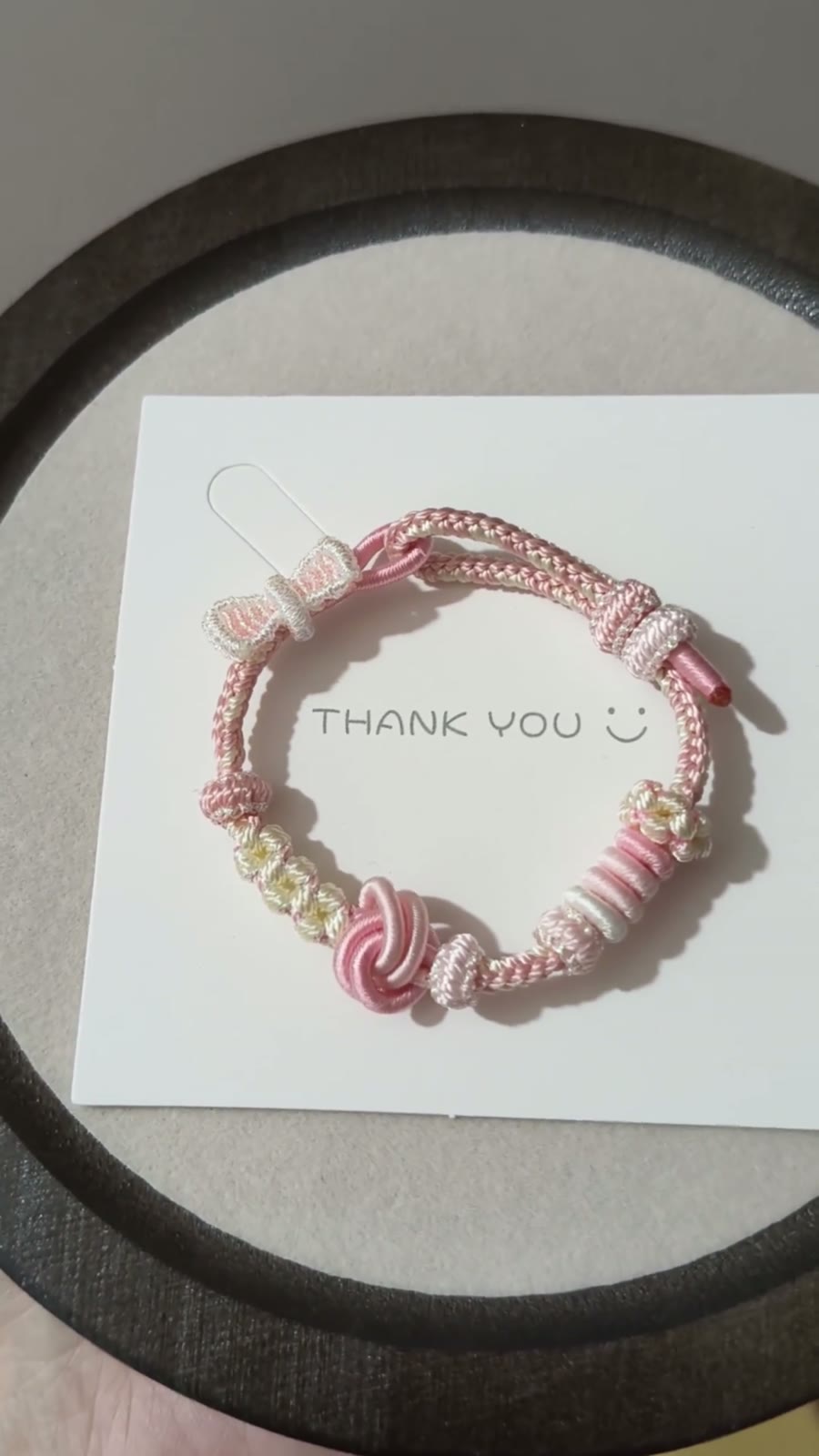 Braccialiale in cordino intrecciato a mano sfumatura rosa bianco