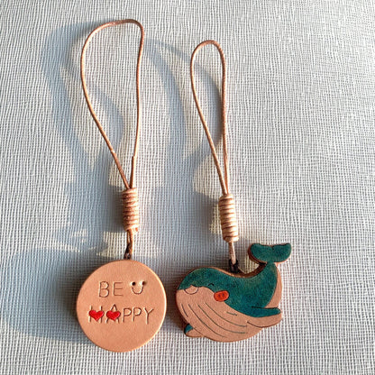Handcrafted Leather Pendants: "BE HAPPY" Disc and Whale Charm