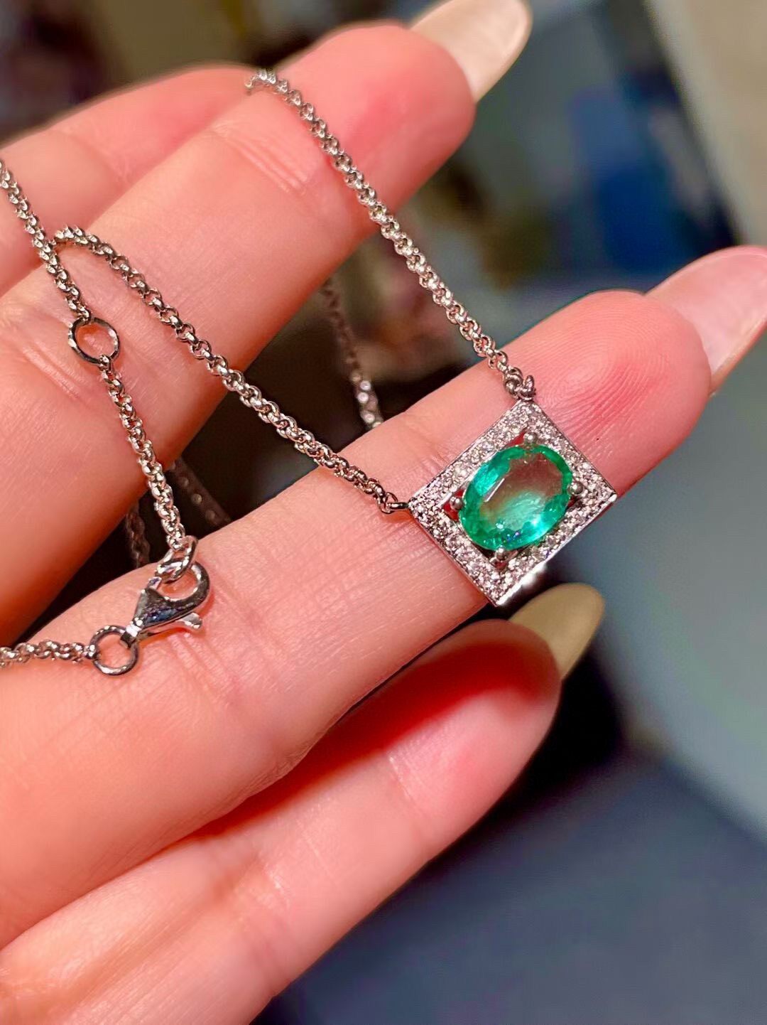 Platinum Pendant Necklace with 0.98 Carat Oval Emerald and Diamond Halo