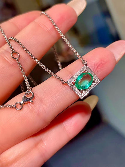 Platinum Pendant Necklace with 0.98 Carat Oval Emerald and Diamond Halo
