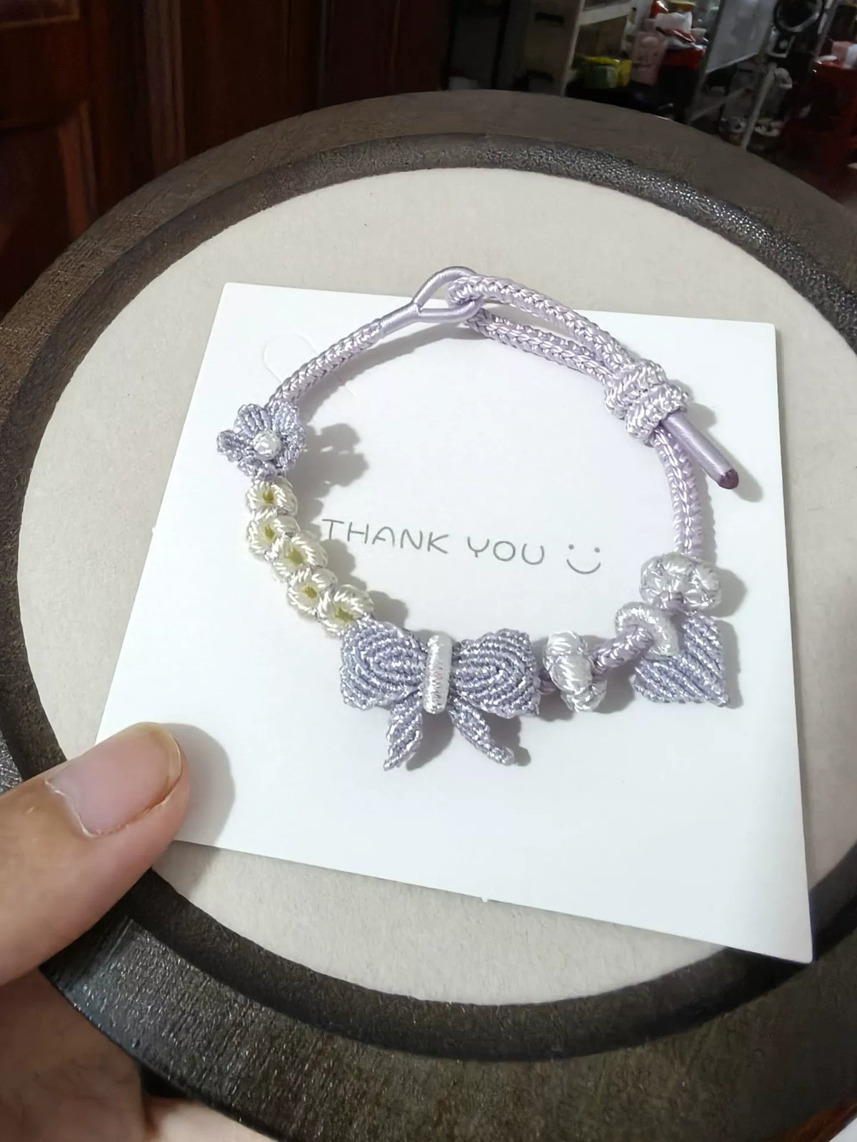 Braccialiale in cordino con sfumatura viola e bianco