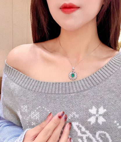 Pt950 Platinum 1.26ct Emerald and 0.53ct Diamond Halo Pendant