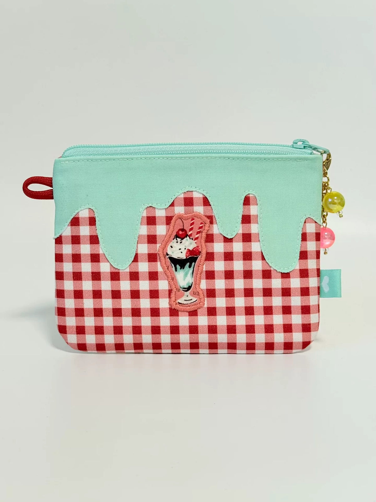 Estuche con cremallera y estampado de postres y forro menta