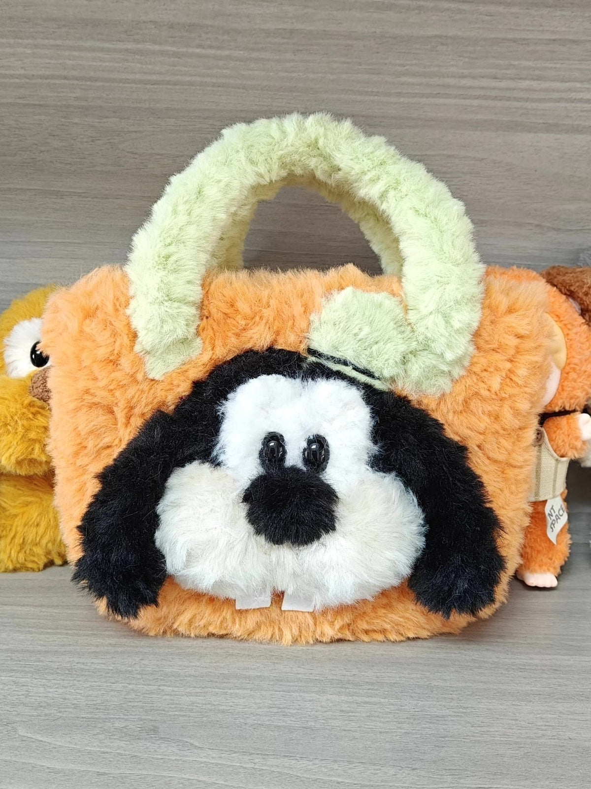 Orange Plüsch-Henkelhandtasche mit Tiergesicht