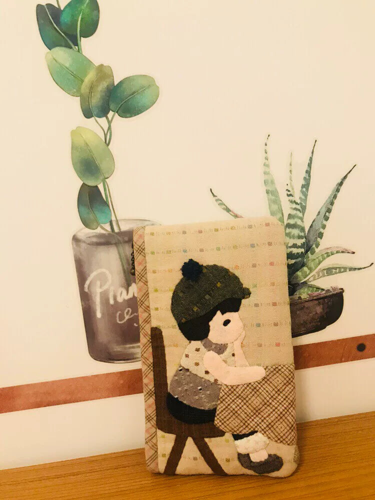 Estuche con cremallera de tejido teñido de hilo hecho a mano