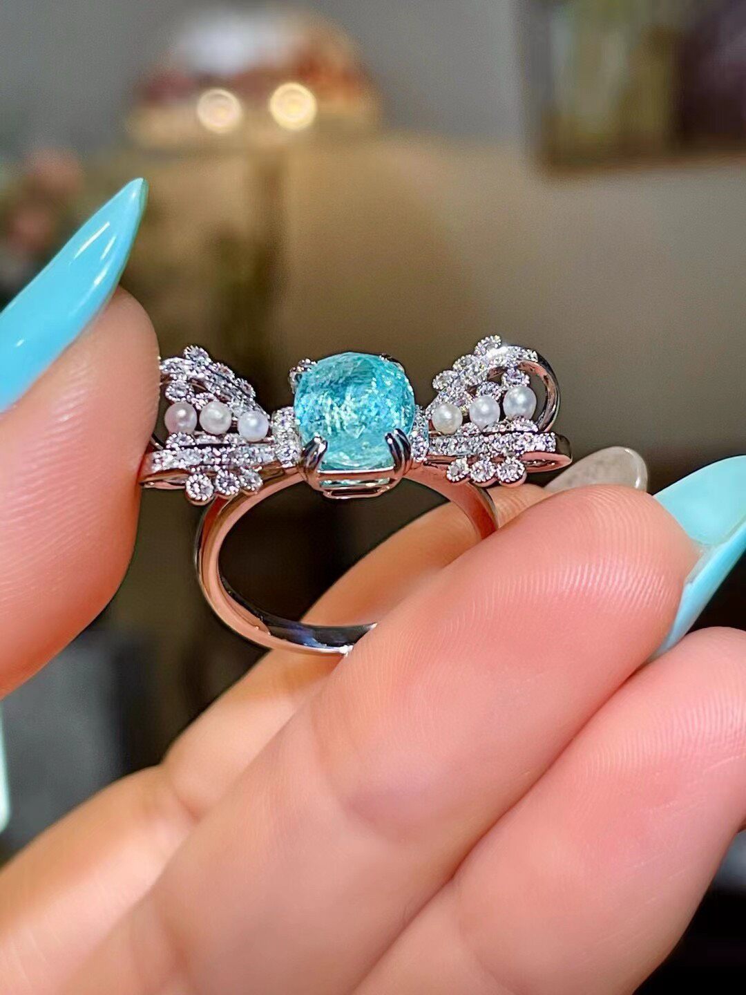 18k Gold Ring with Cushion-Cut Neon Blue Gem, Diamond and Pearl Bow-Tie Wings