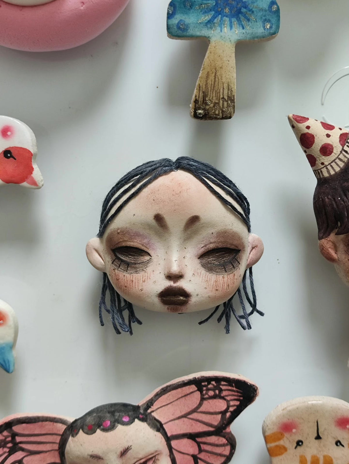 Clay Doll Head Brooch