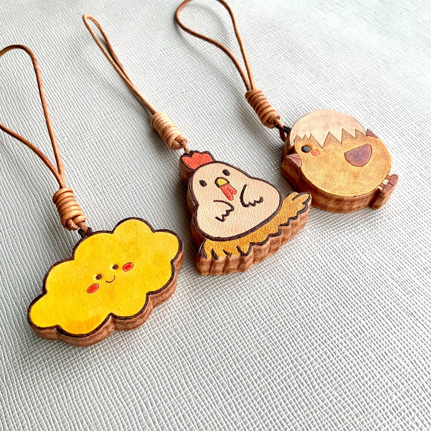 Handcrafted Leather Charm Set with Cartoon Motifs