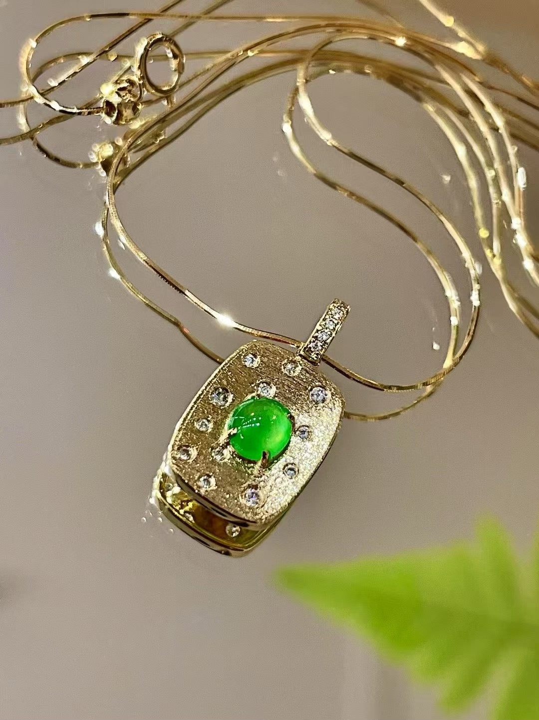 18k Gold Pendant with Oval Green Cabochon and 0.10ct Clear Stones