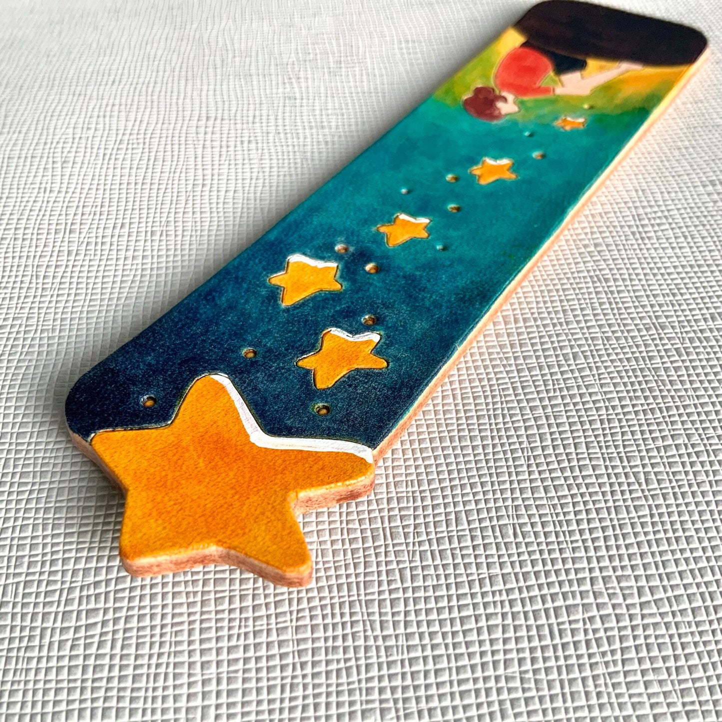 Hand-Painted Leather Bookmark with Star Cutouts